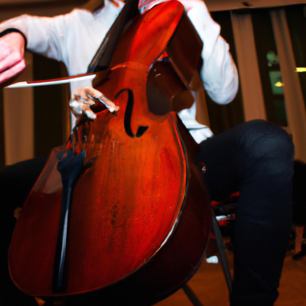 Person playing cello on stage