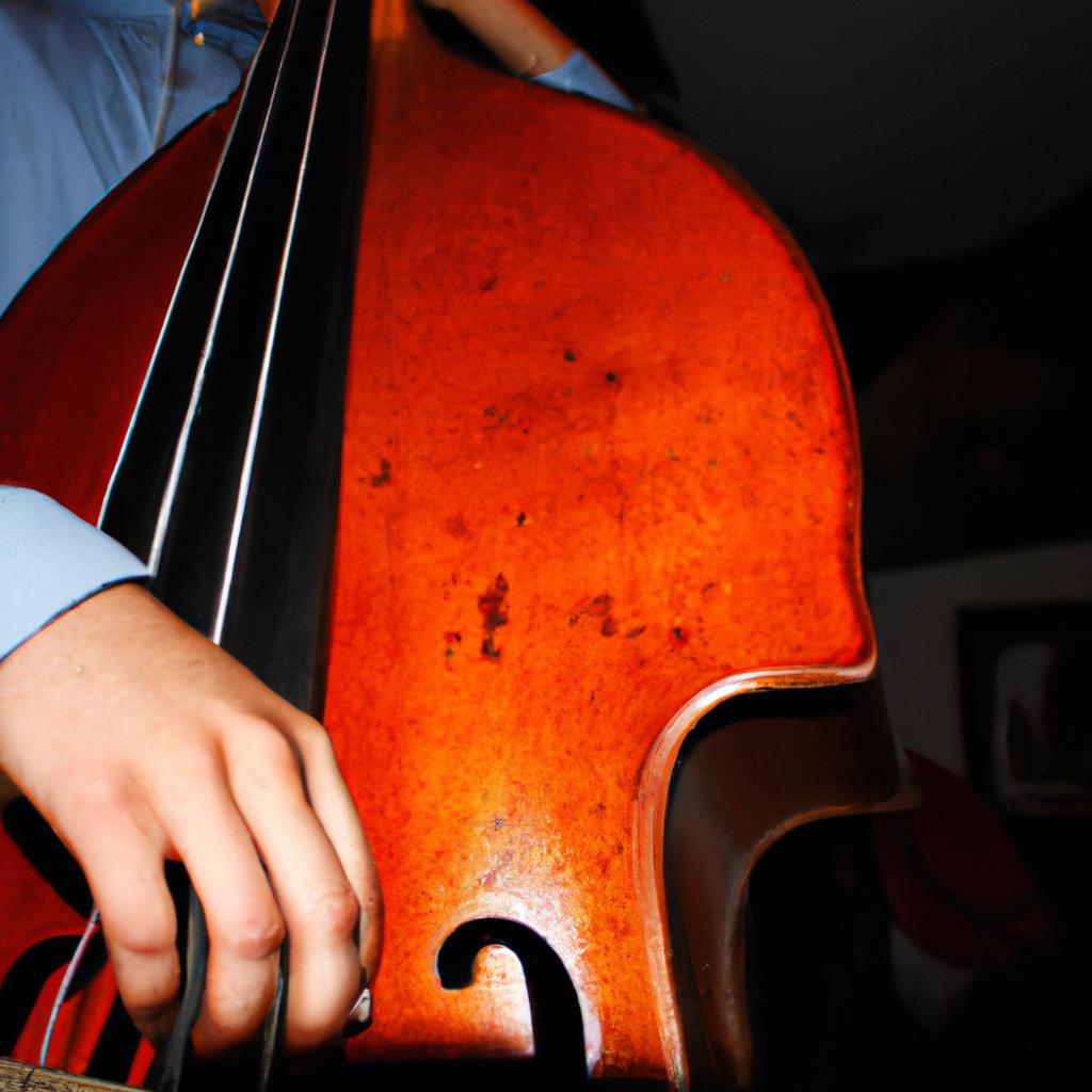 Person playing double bass instrument