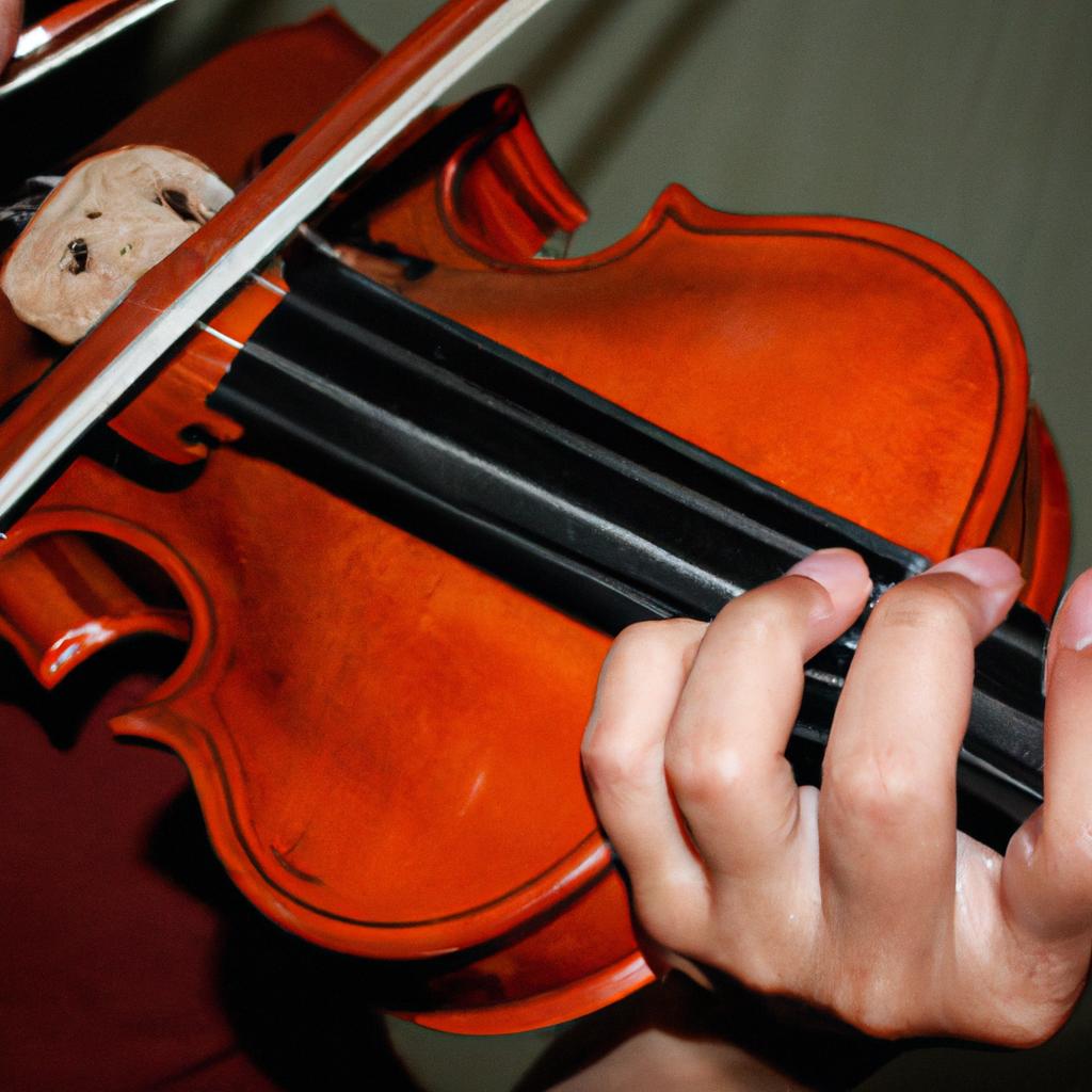 Person playing a violin instrument